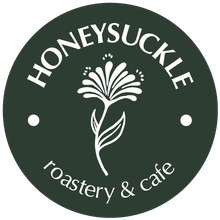 A honeysuckle roastery and cafe logo with a flower on it