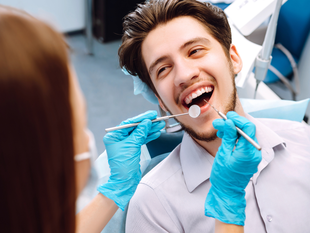 Man in dental chair getting a cleaning