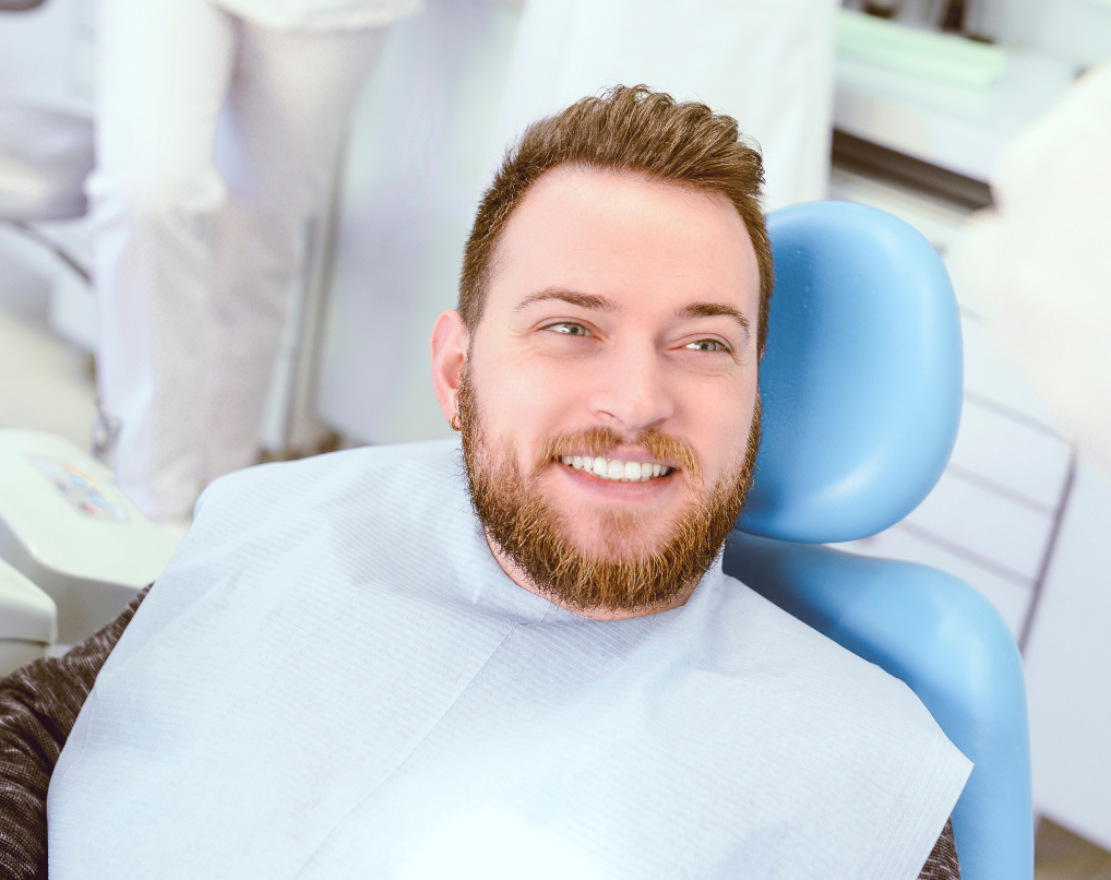 Photo of man who appears to be listening to the dentist for advice/