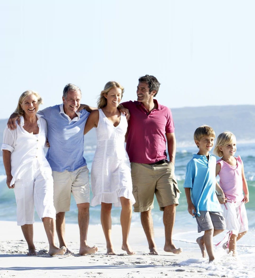 Group of people walking on beach