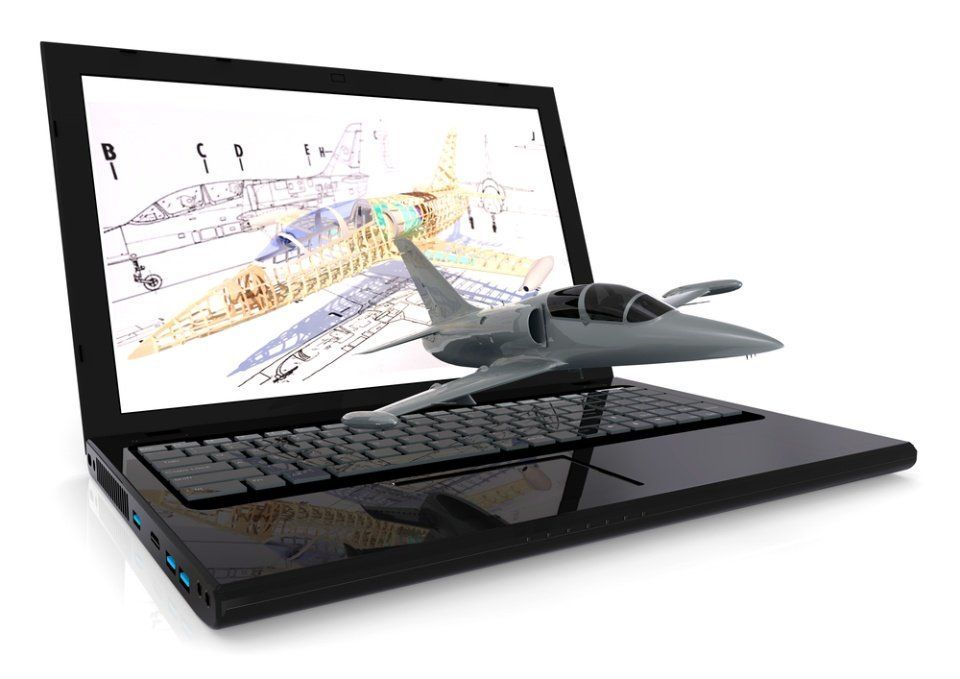A fighter jet is coming out of a laptop screen.
