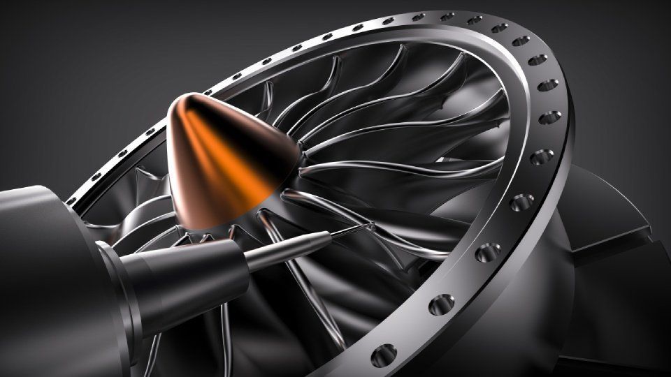 A close up of a jet engine with a cone on it