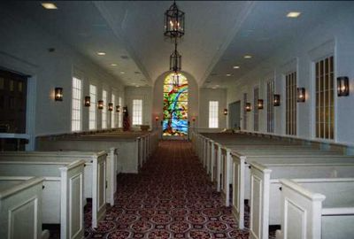 The inside of a church with a stained glass window