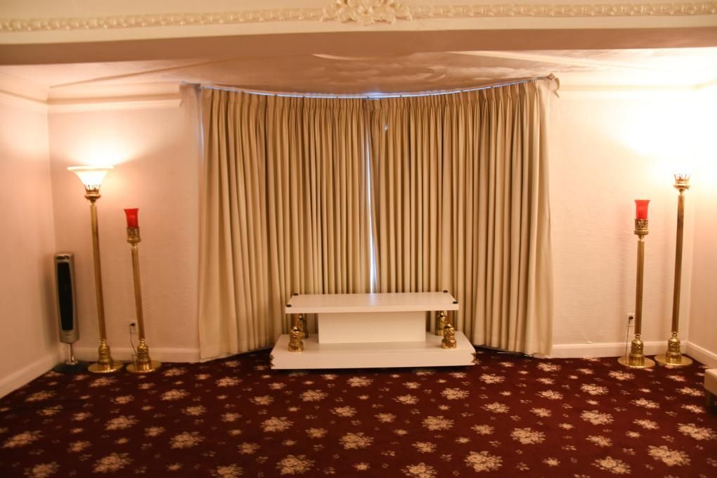 A room with a table and candles in it