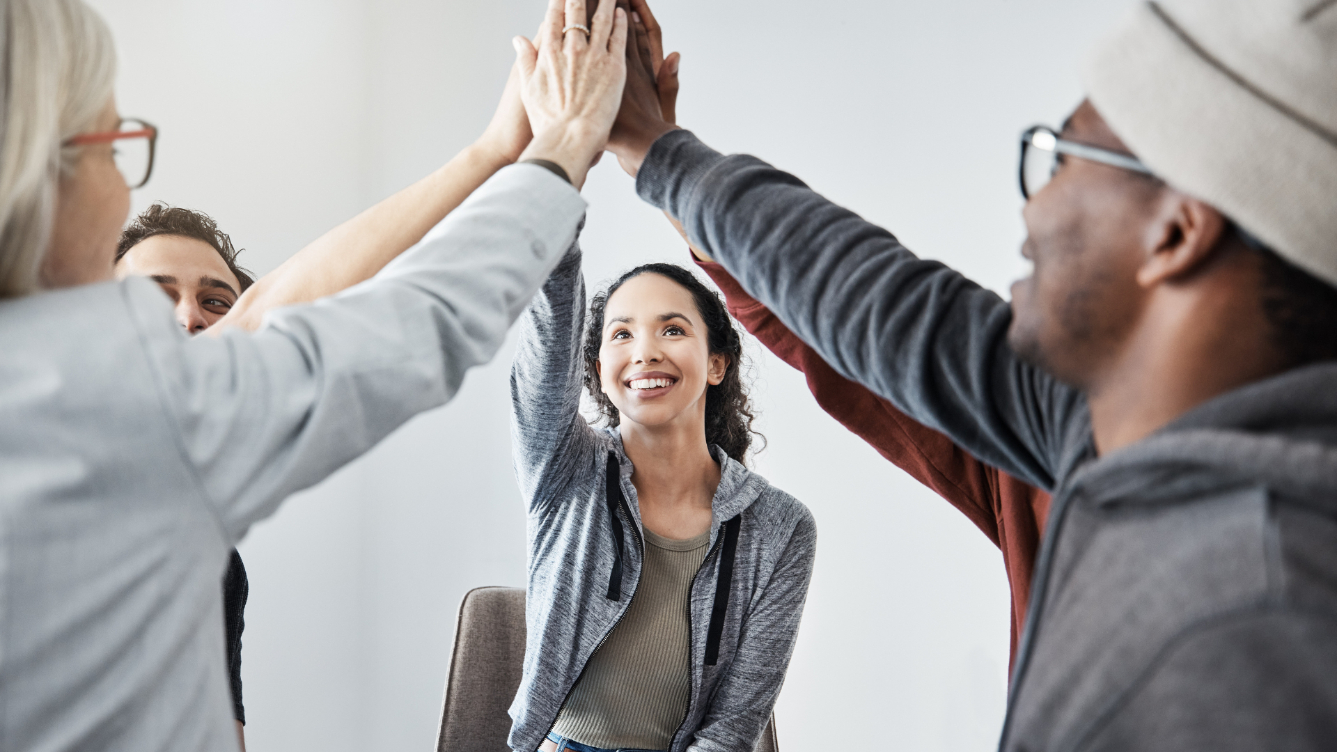 Syringe needle piercing a medicine vial, drawing up medication.