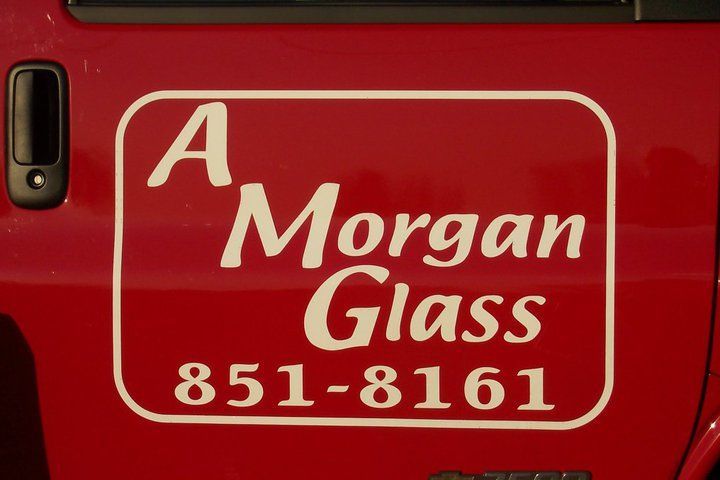 Red vehicle door with a white logo: 