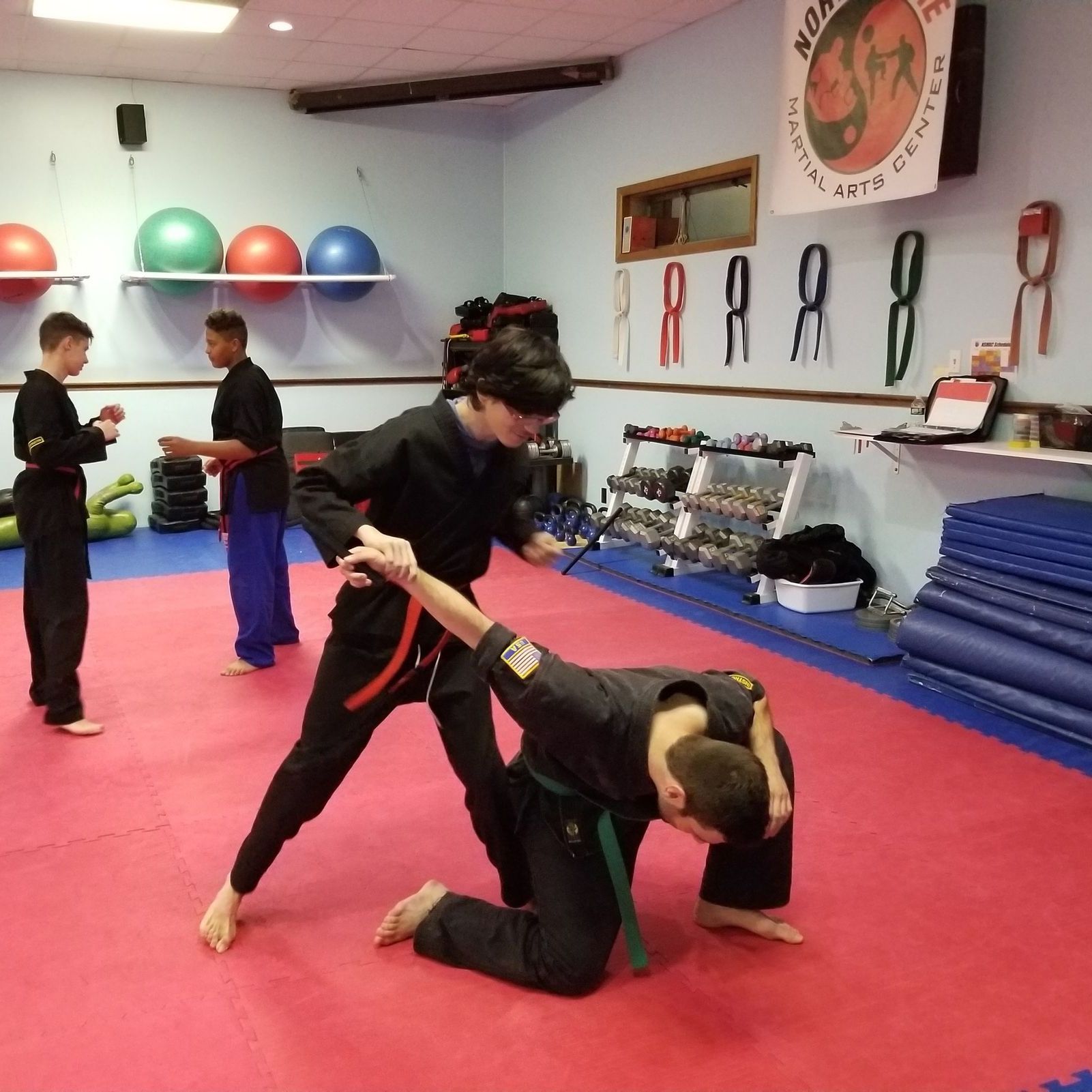 a group of martial arts fighters pose for a picture