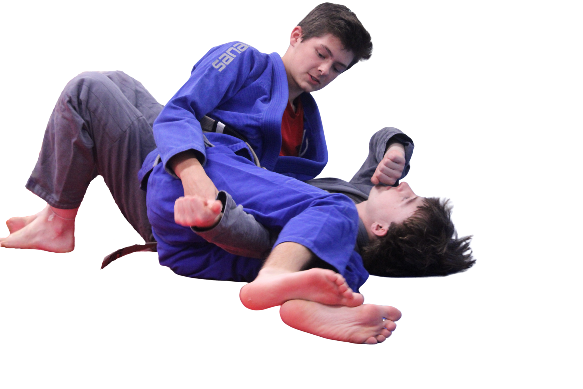 two men in blue kimonos are wrestling on a white background .