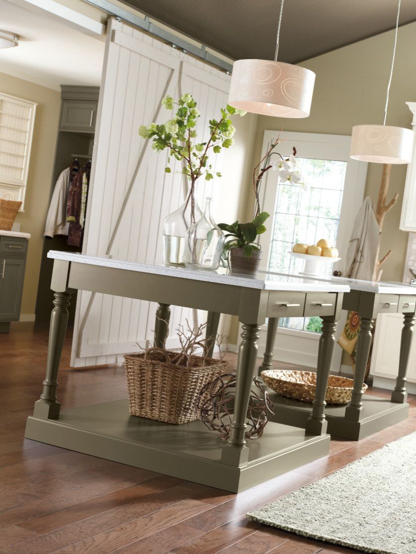 A table in a room with a sliding barn door behind it