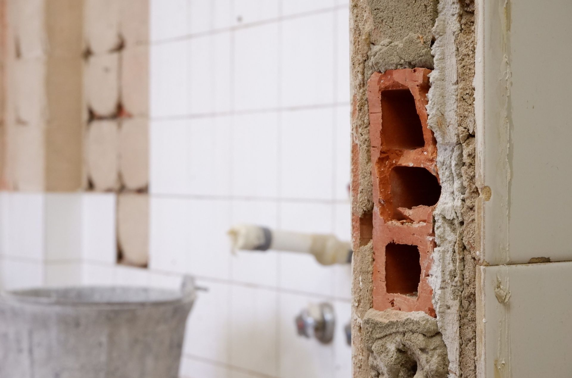 Close-up of bathroom drywall showing water damage.
