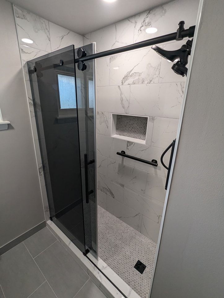 Marble Tile Shower with Glass Door