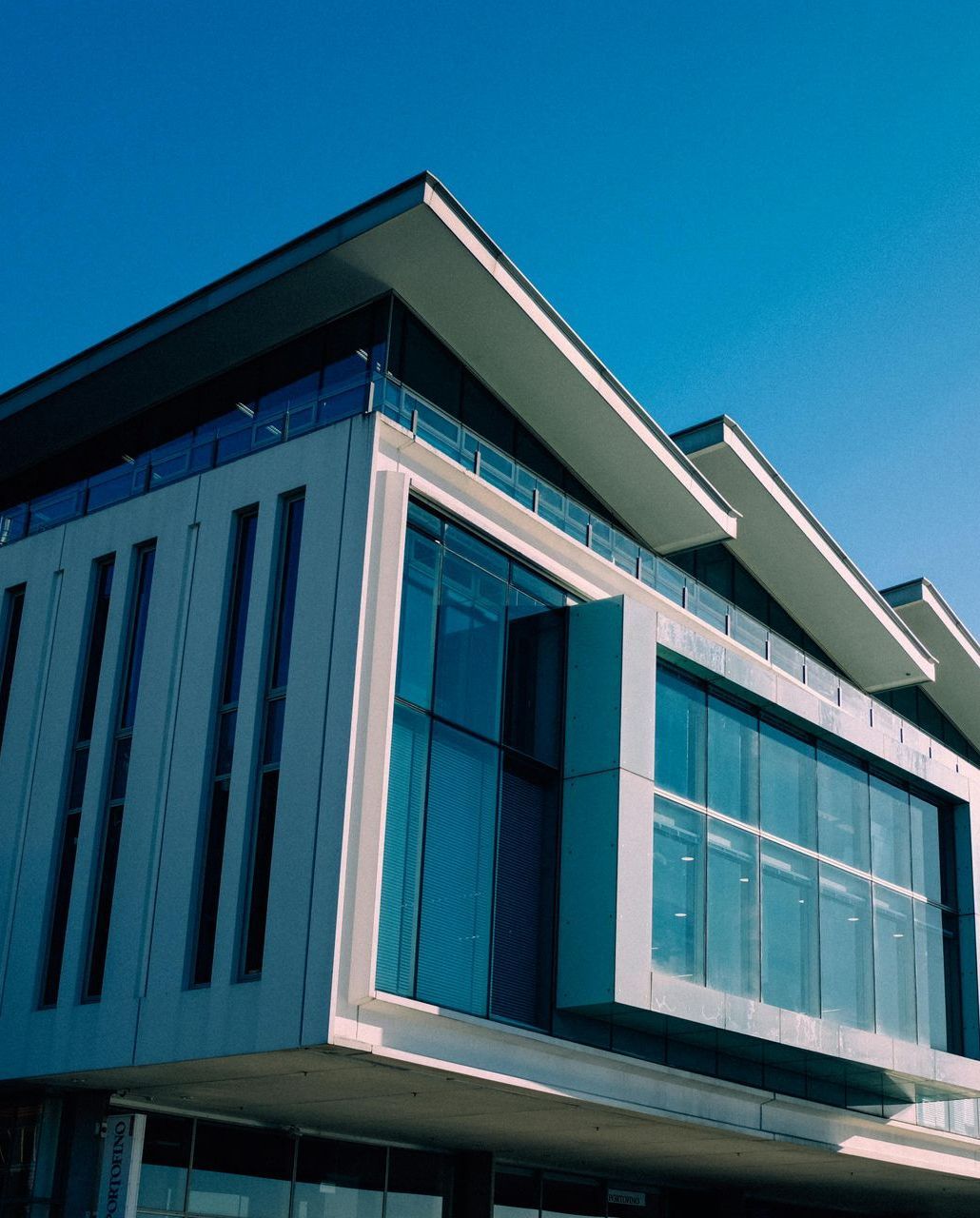 A large building with a blue sky in the background