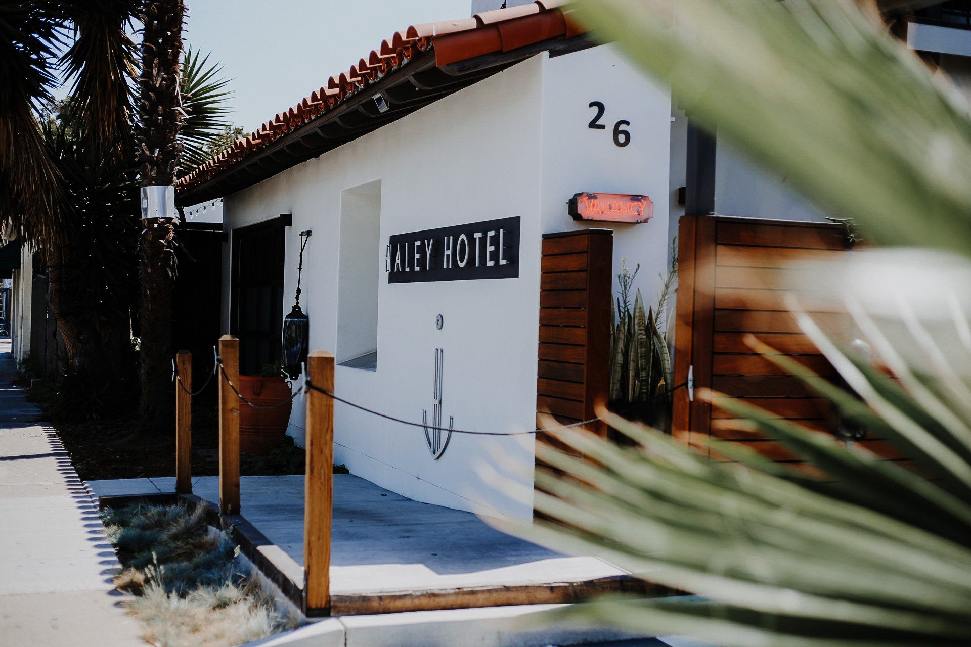 The entrance wit the VACANCY sign and Street address