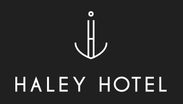 Haley Hotel white logo black background