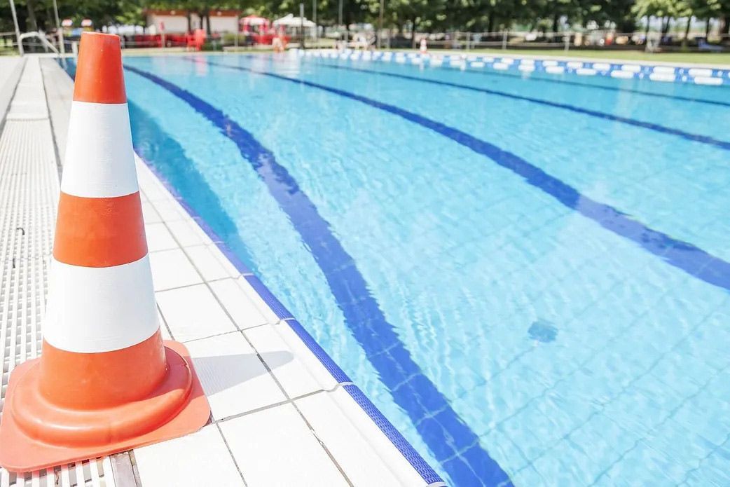 Traffic Cone Next to a Swimming Pool — Billabong Pool Service & Supply Pty Ltd in Buderim, QLD