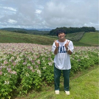 A group of women are sitting at a table talking to each other.