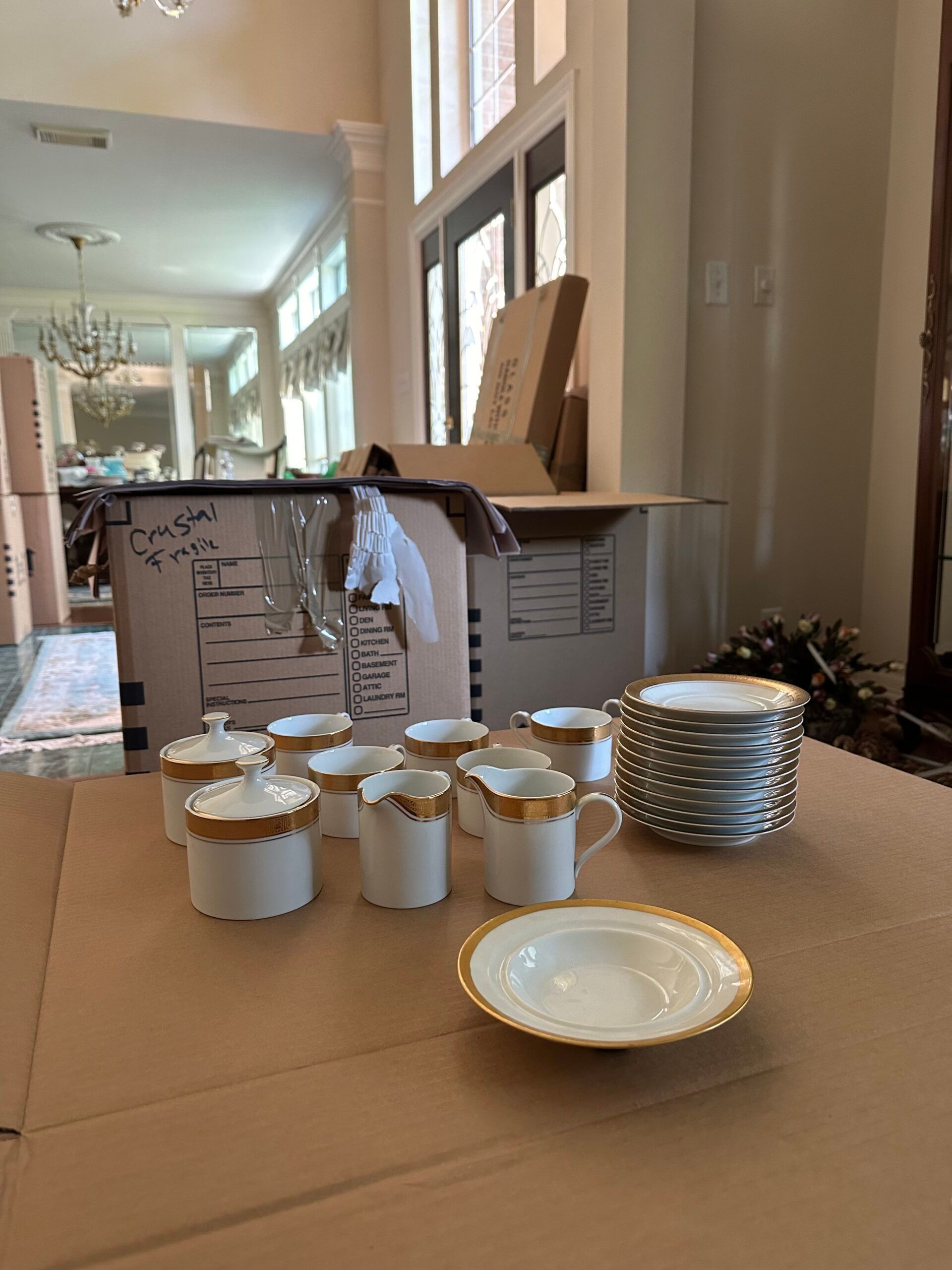 A table with plates , cups and saucers on it.