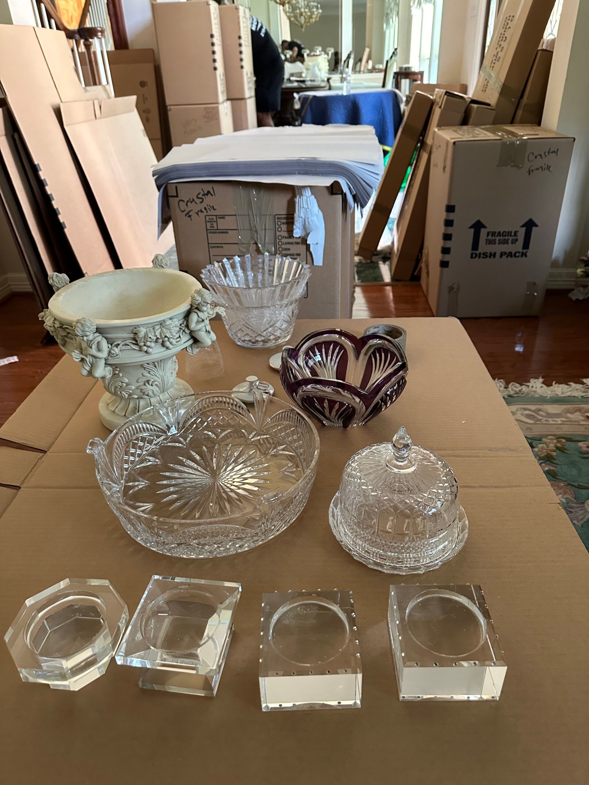 A table with a lot of glass objects on it