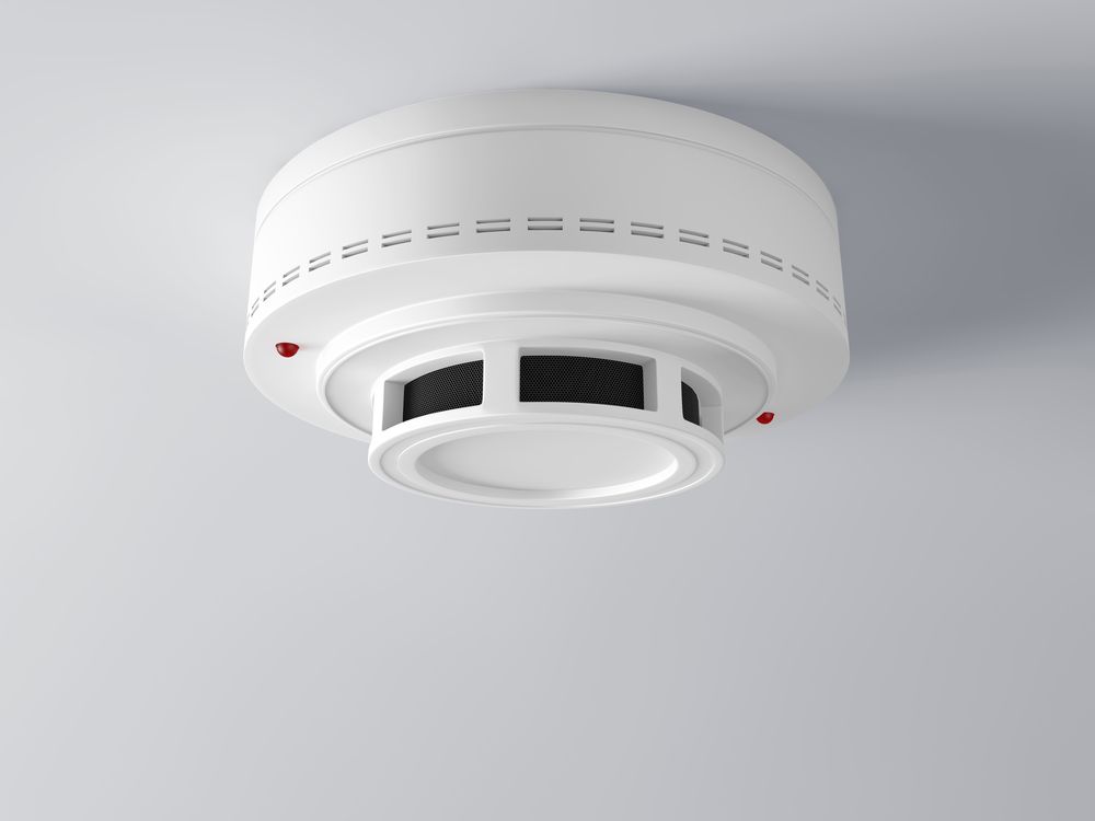White Ceiling-mounted Smoke Detector With Vents — Hazlec Services Pty Ltd in Yeppoon, QLD