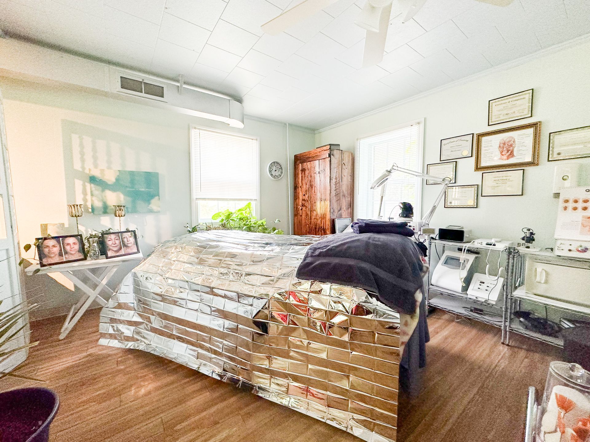 A bedroom with a bed , a desk , and a painting on the wall.
