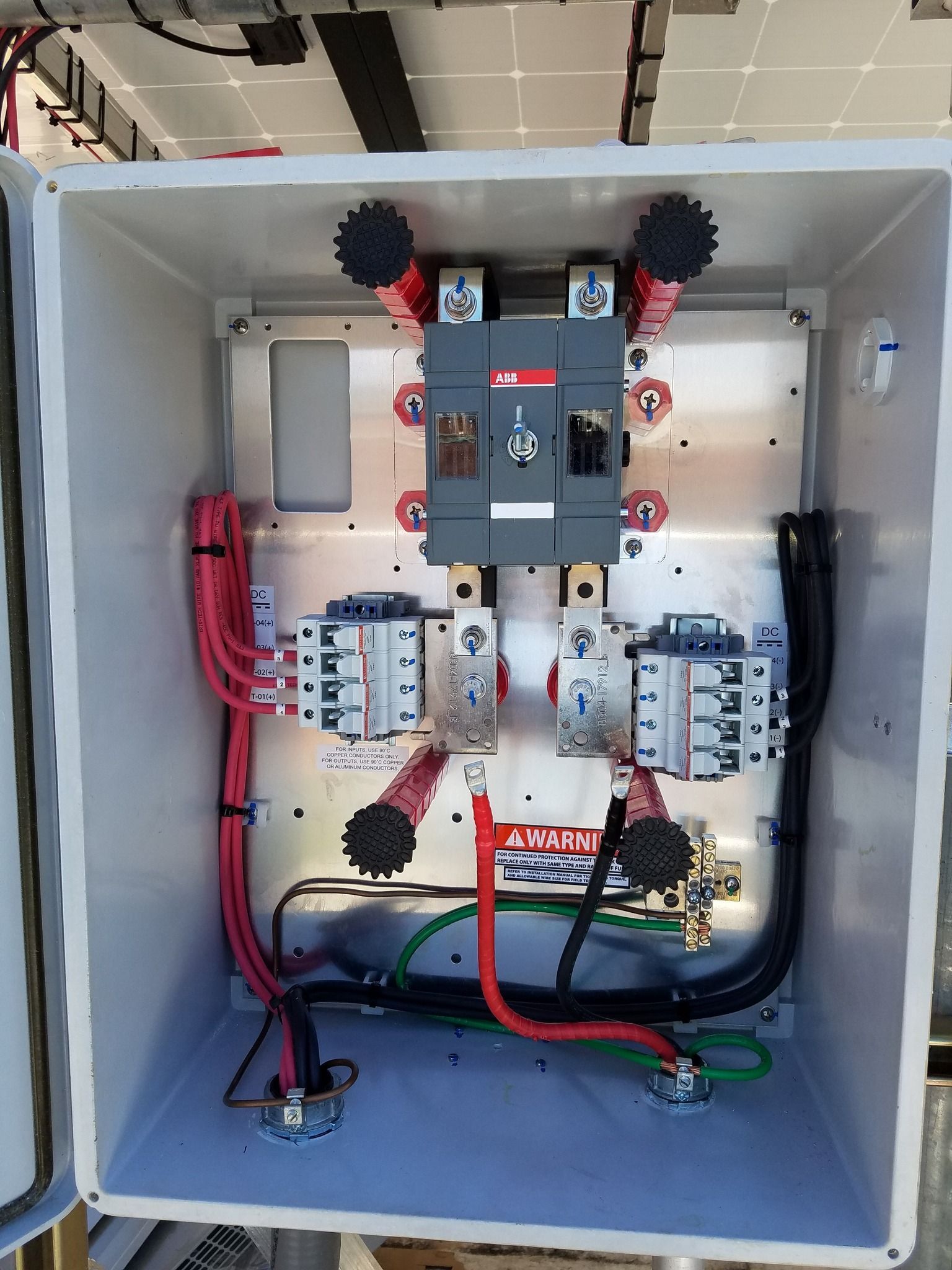 Electrical junction box with circuit breakers and wiring.