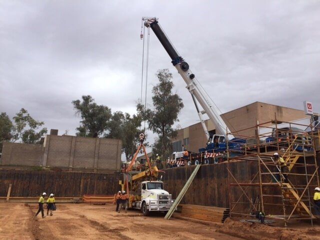 White Crane Unloading Truck Load — Crane Hire in Alice Spring, NT