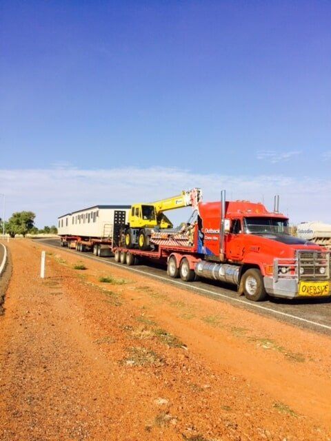 Truck with Heavy Equipment 1 — Crane Hire in Alice Spring, NT