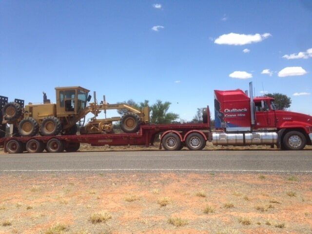 Truck with Loaded Construction Vehicle — Crane Hire in Alice Spring, NT