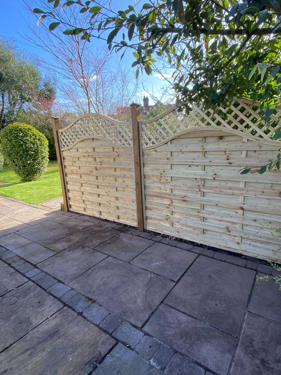 Fencing York arched fence with trellis installed in Dunnington York
