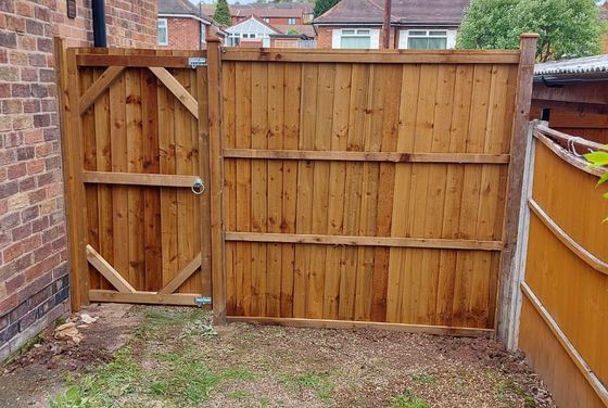 side fencing with wooden gate to access the garden for property in York
