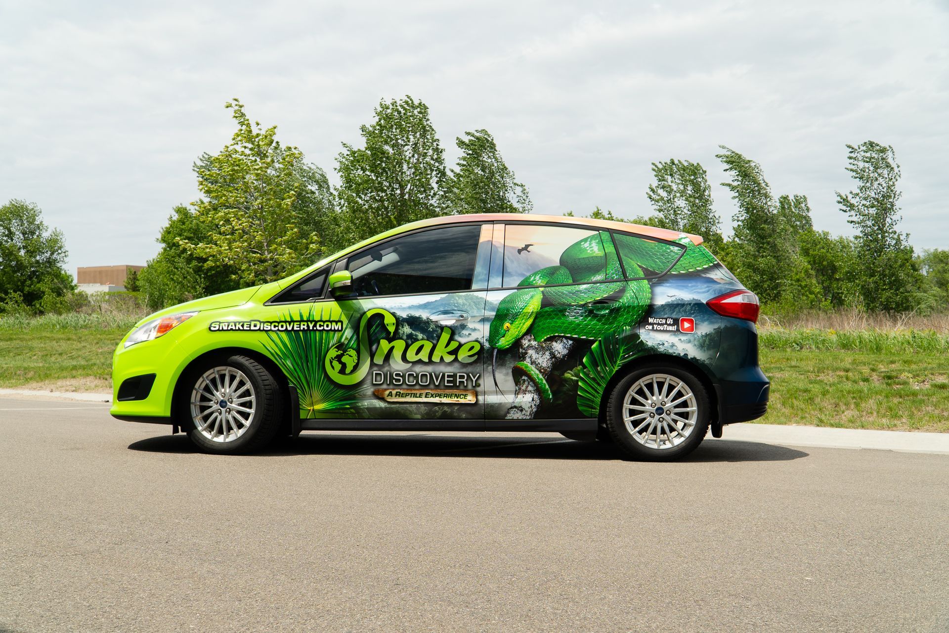 A Bulletproof Builders truck is parked in front of a building. A Bulletproof Builders truck is parked in front of a building.