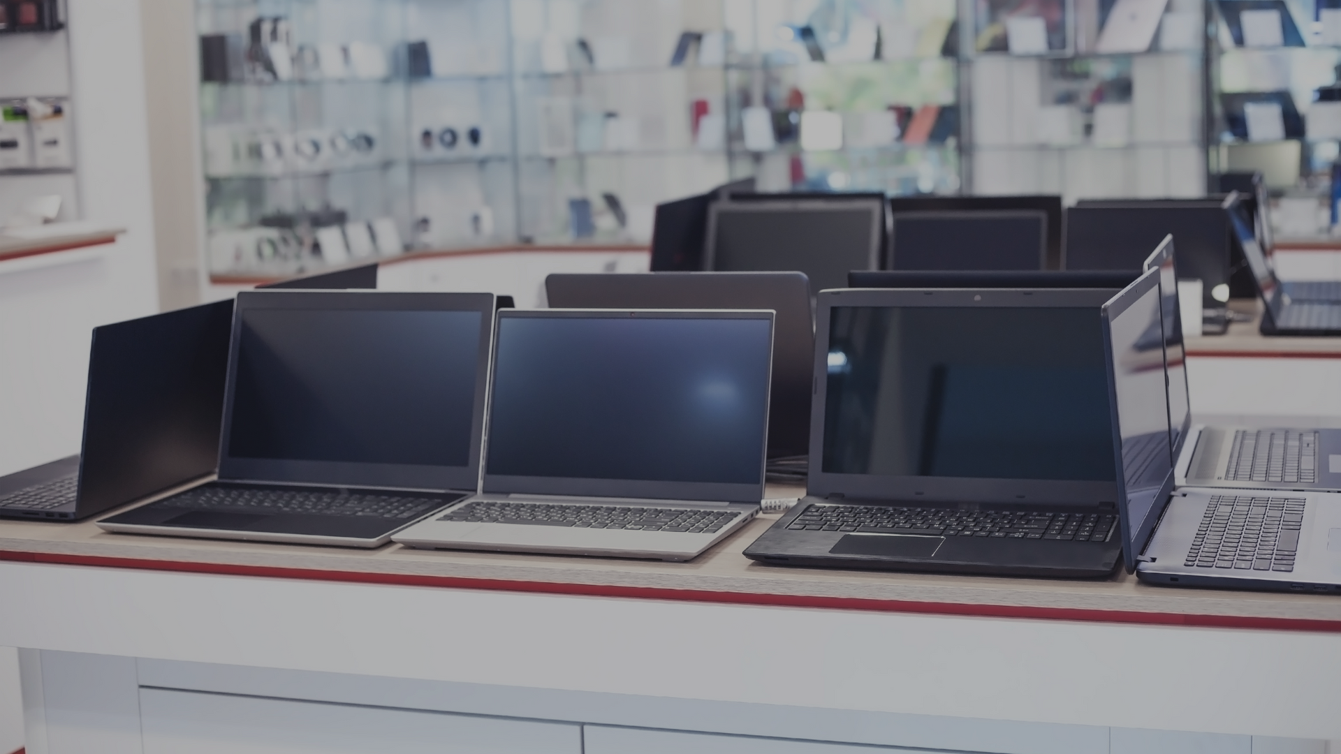 Photo of laptops in a shop ready to be sold 