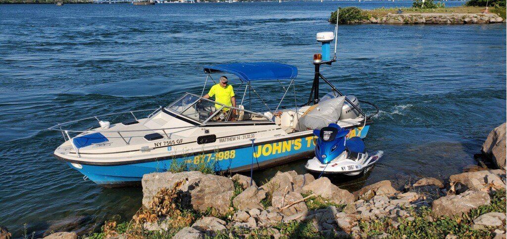 Man Inside The Boat — Buffalo, NY — John’s Towing & Storage