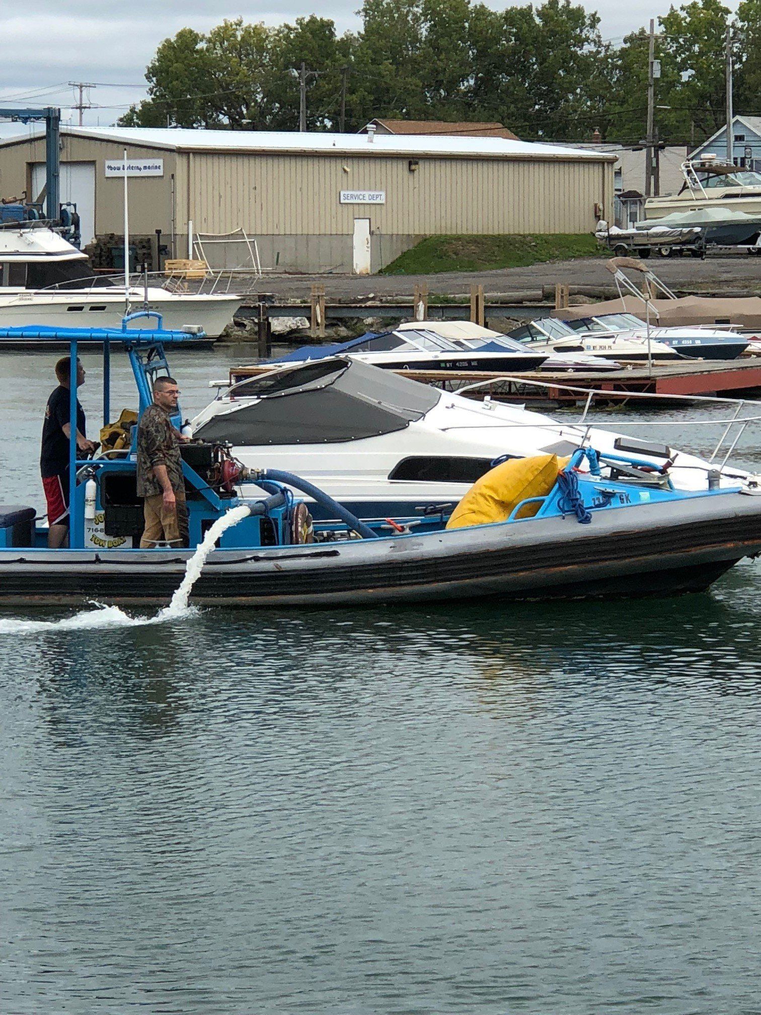 Two Man At The Boat — Buffalo, NY — John’s Towing & Storage