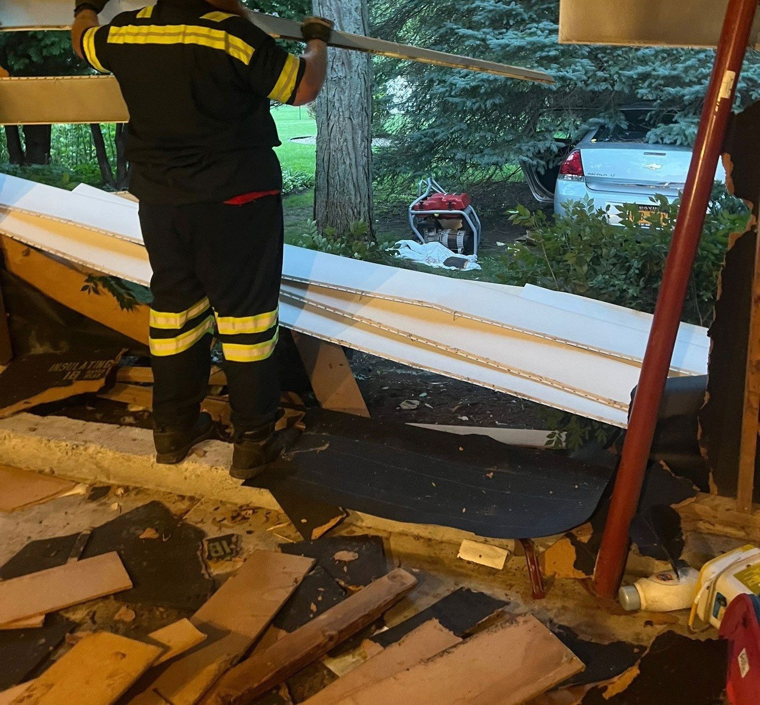Man Removing Of Damaged Wall — Buffalo, NY — John’s Towing & Storage