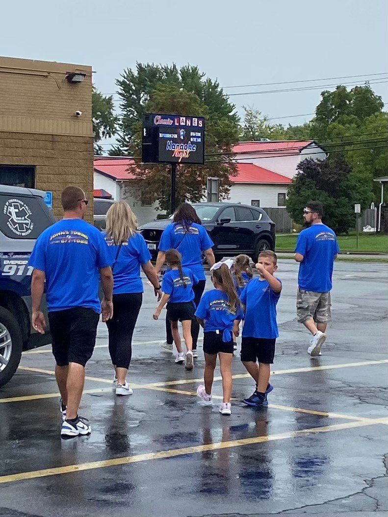 Family Walking — Buffalo, NY — John’s Towing & Storage