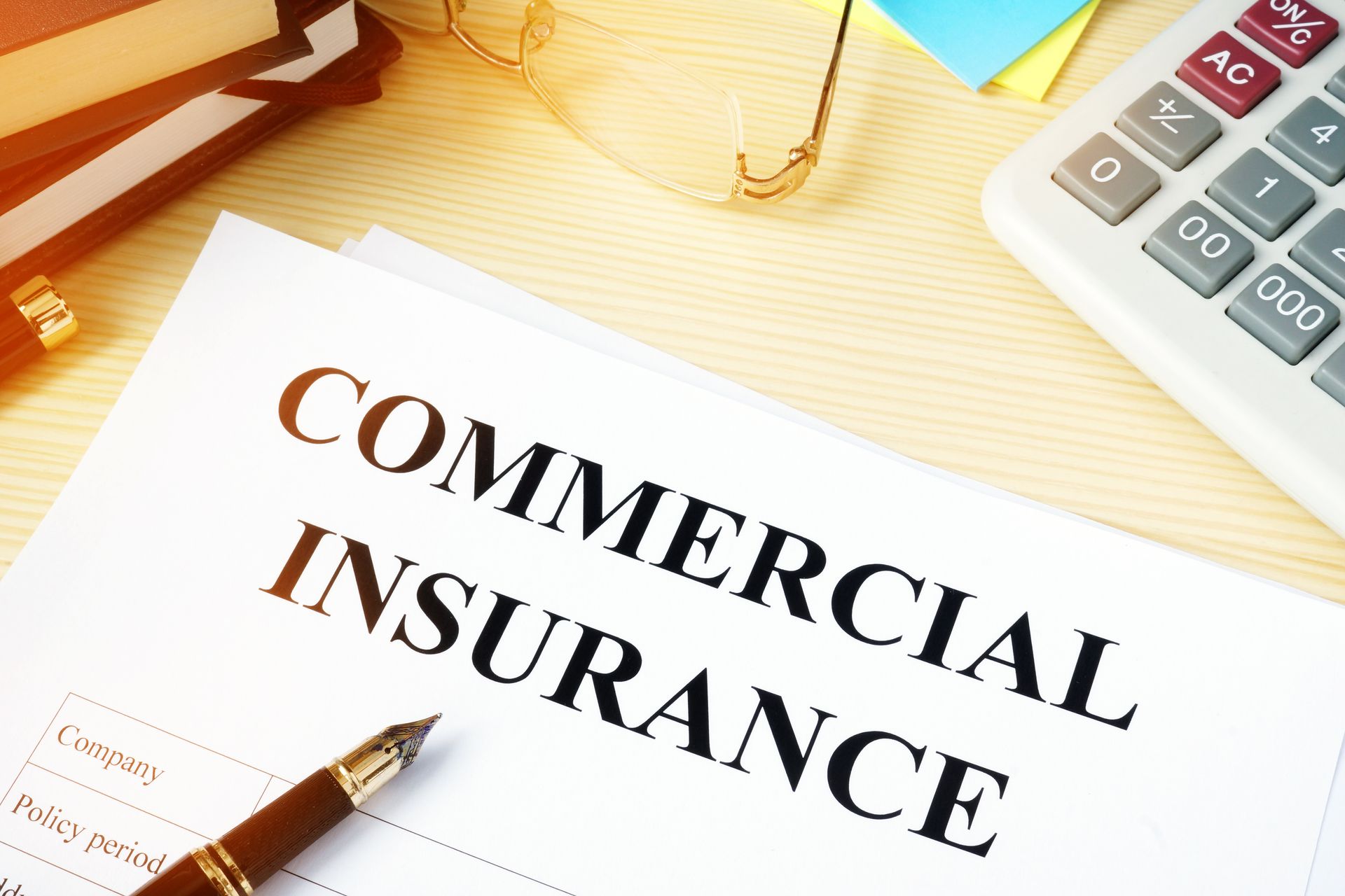 Commercial insurance policy on an office desk. Commercial insurance policy on an office desk.