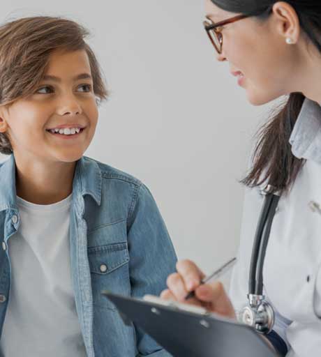 Doctor and Boy Having Consultation — Bakersfield, CA — Pedi Center Urgent Care