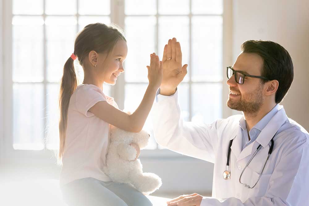 Girl Giving High Five to Doctor — Bakersfield, CA — Pedi Center Urgent Care