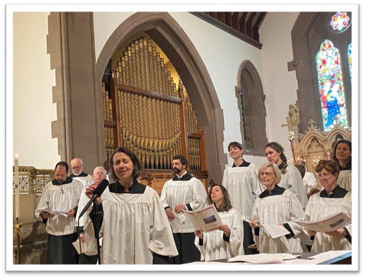 A group of people are singing in a church.