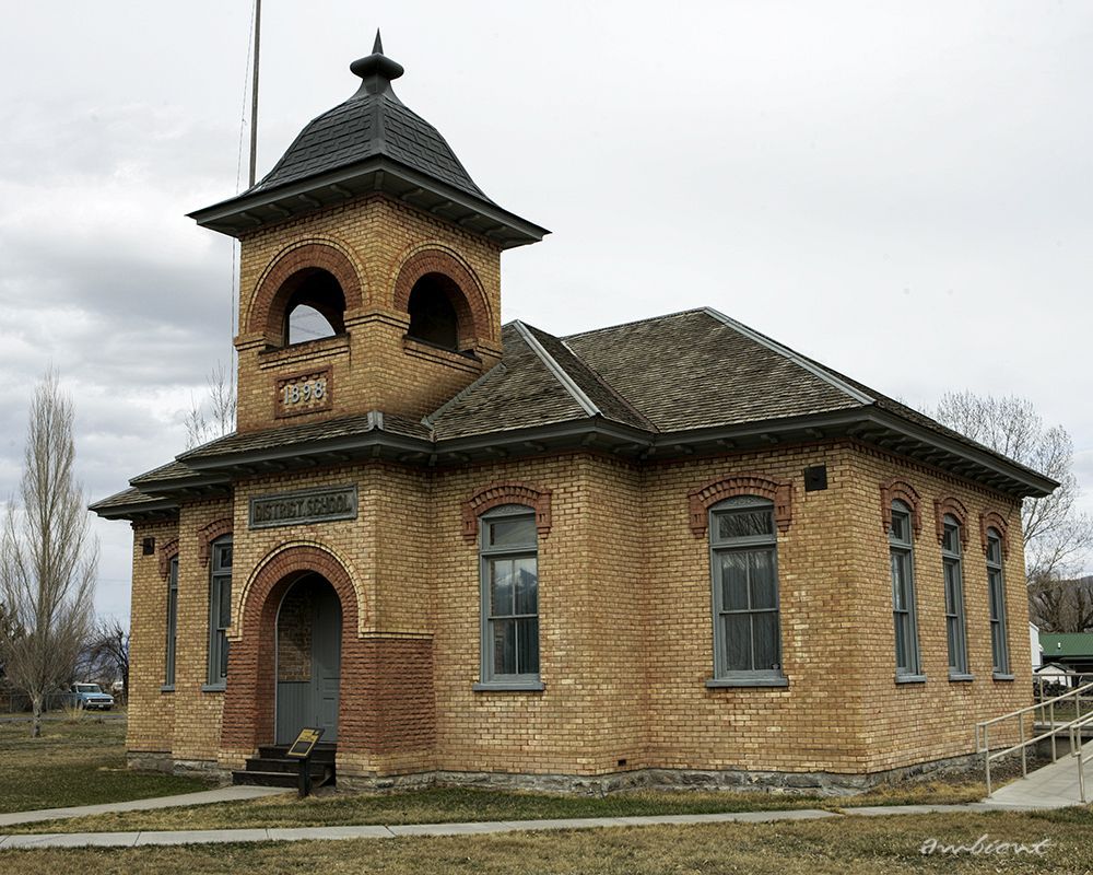 An old brick building with a tower on top of it