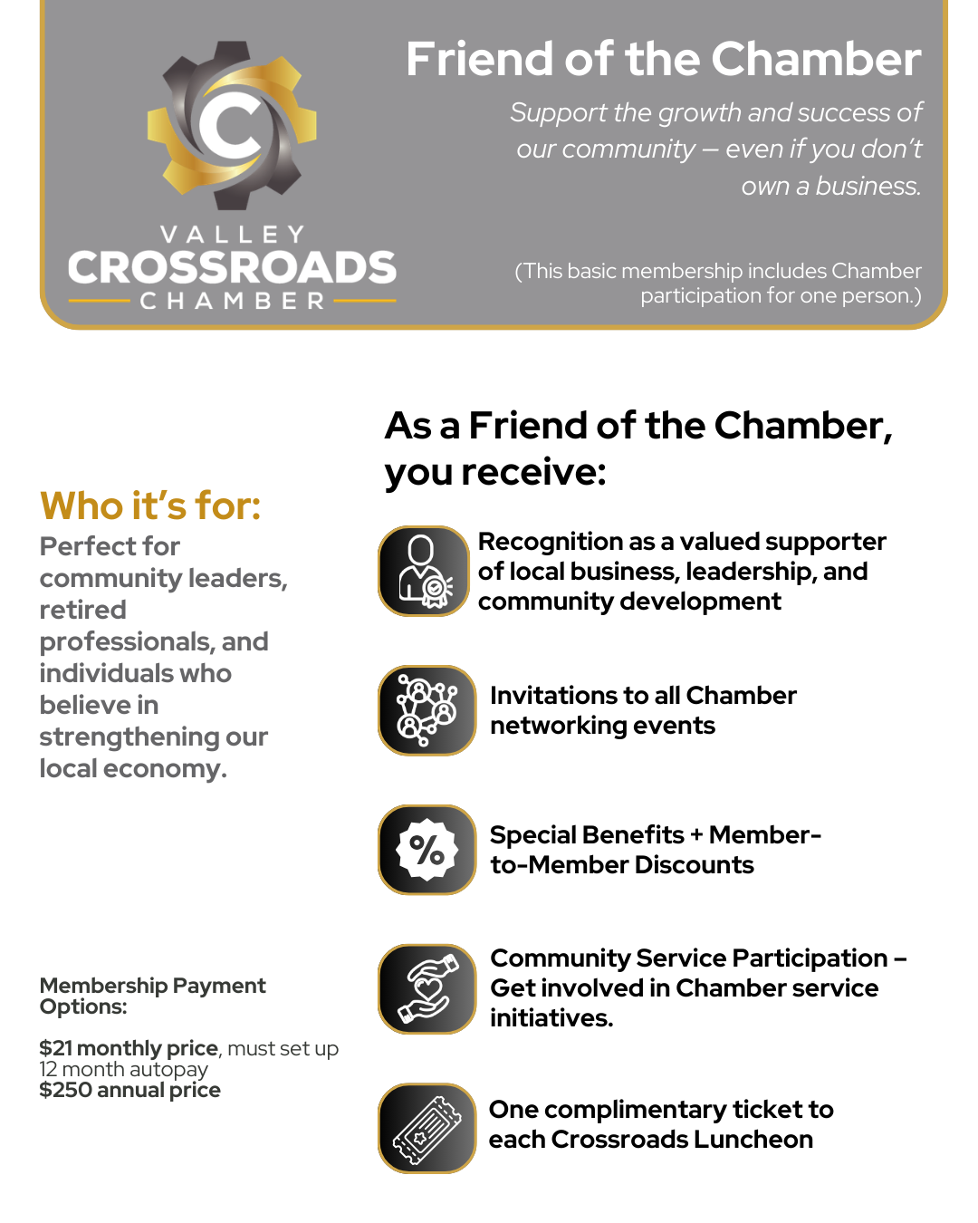 A woman is sitting at a desk talking on a cell phone