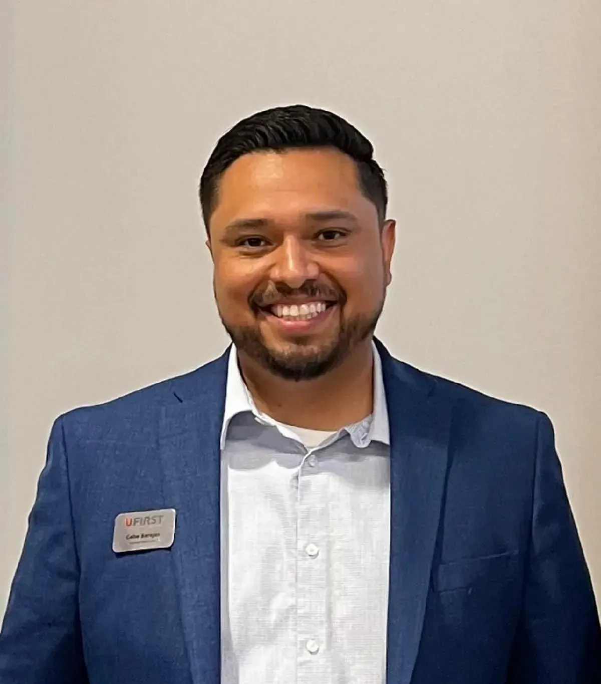 A woman wearing a large hat with her eyes closed.