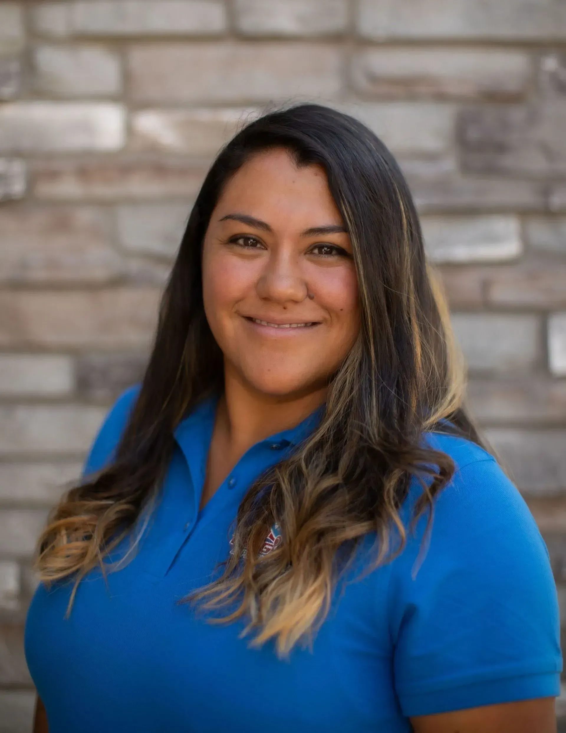 A man with a beard is holding flowers in his mouth.