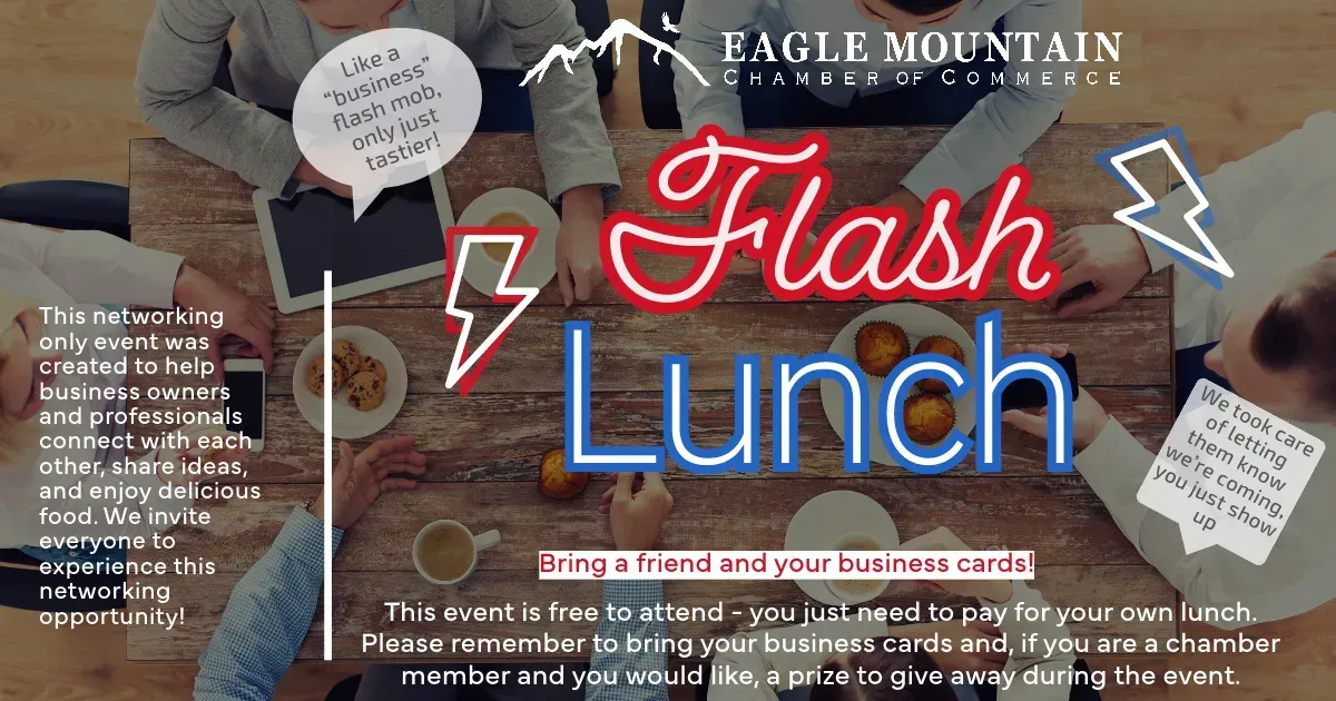 A group of people are sitting around a table with a sign that says flash lunch.