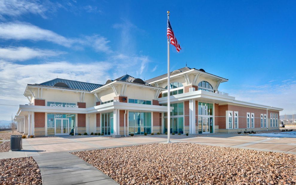 A large building with a flag flying in front of it