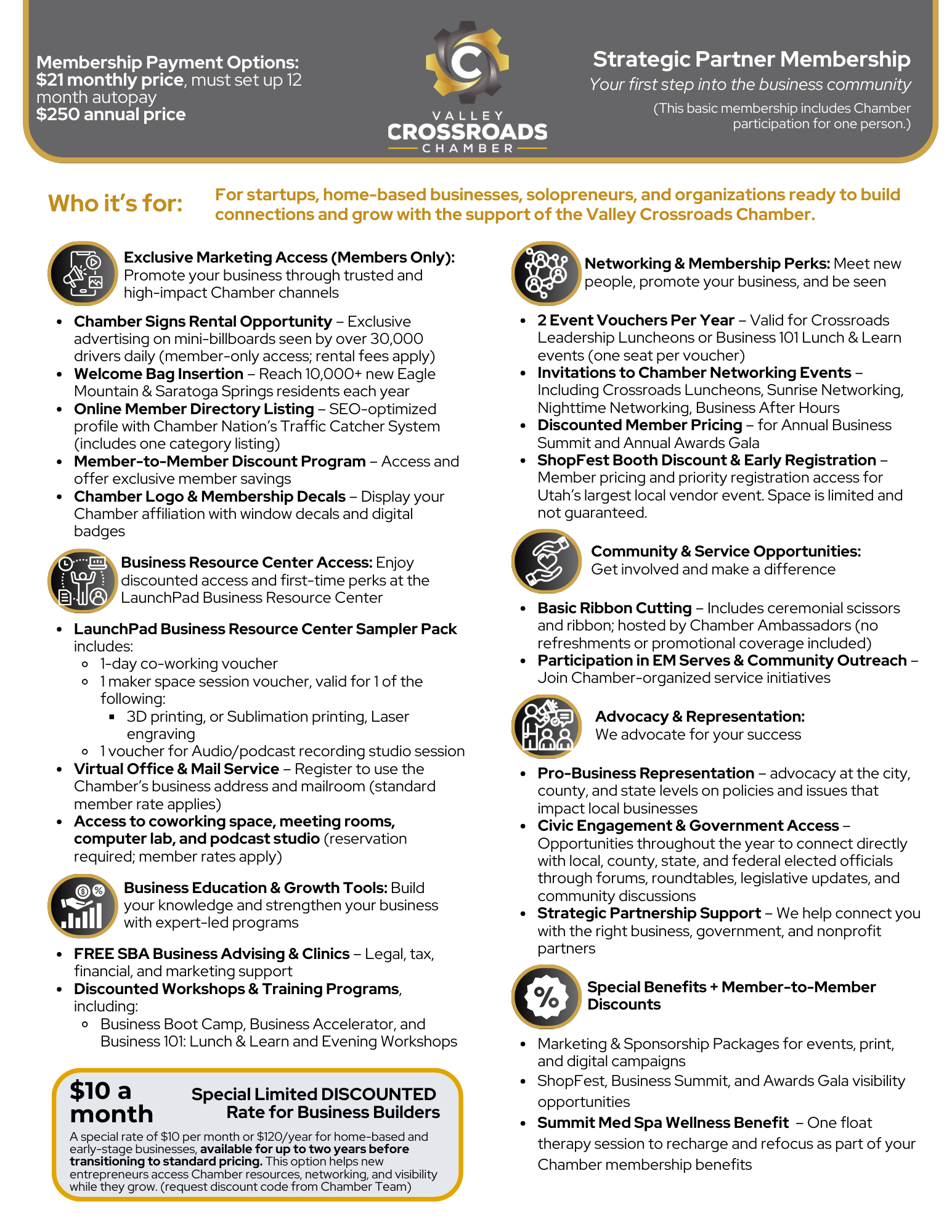 A woman is sitting at a desk talking on a cell phone