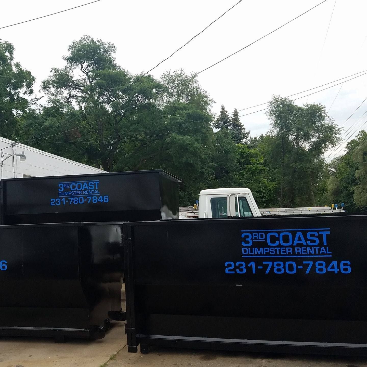 Black dumpsters with 