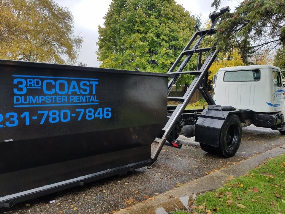 Black dumpster on truck with 