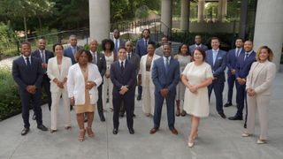 A woman holding a sign that says indians are red